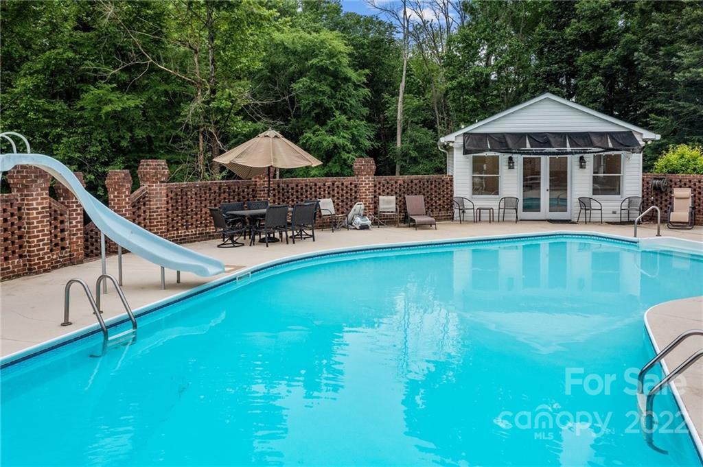 1215 Shive Road Salisbury, NC 28146 - Photo 10 of 48 a swimming pool with outdoor seating and yard