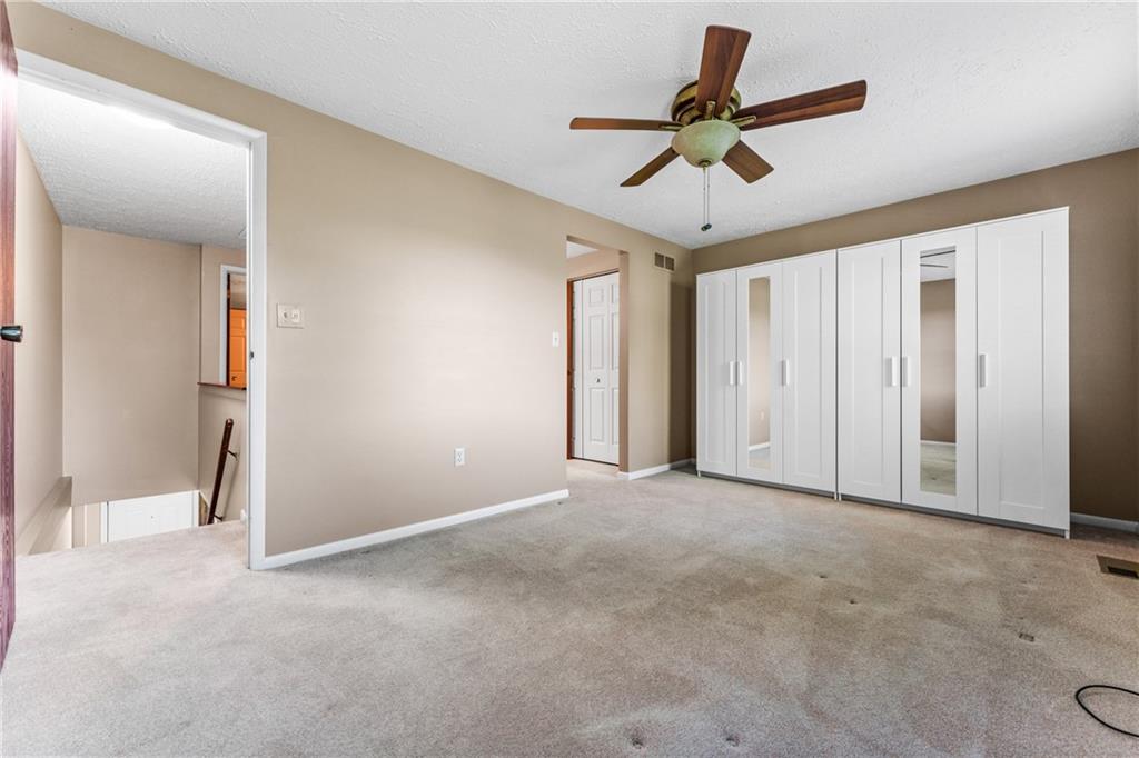 113 Forest Drive Seven Fields, PA 16046 - Photo 16 of 32 an empty room with ceiling fan and window