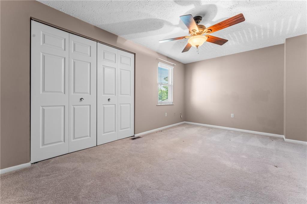 113 Forest Drive Seven Fields, PA 16046 - Photo 20 of 32 an empty room with windows and fan