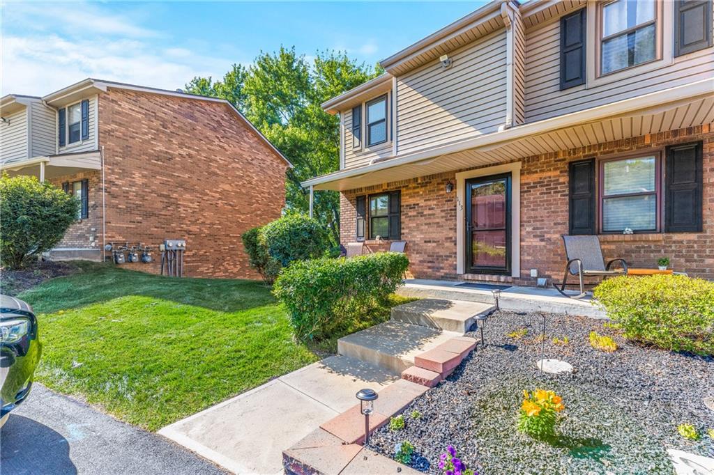 113 Forest Drive Seven Fields, PA 16046 - Photo 3 of 32 a front view of a house with garden