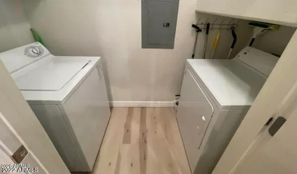 an empty room with windows and flat screen tv