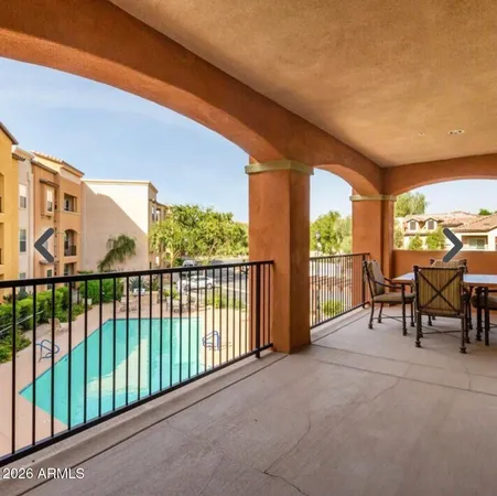 a patio with table and chairs