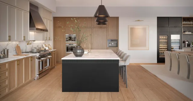 a kitchen with stainless steel appliances granite countertop a stove a sink dishwasher and a refrigerator with wooden floor