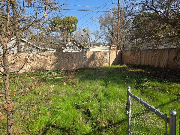 a backyard of a house with lots of green space