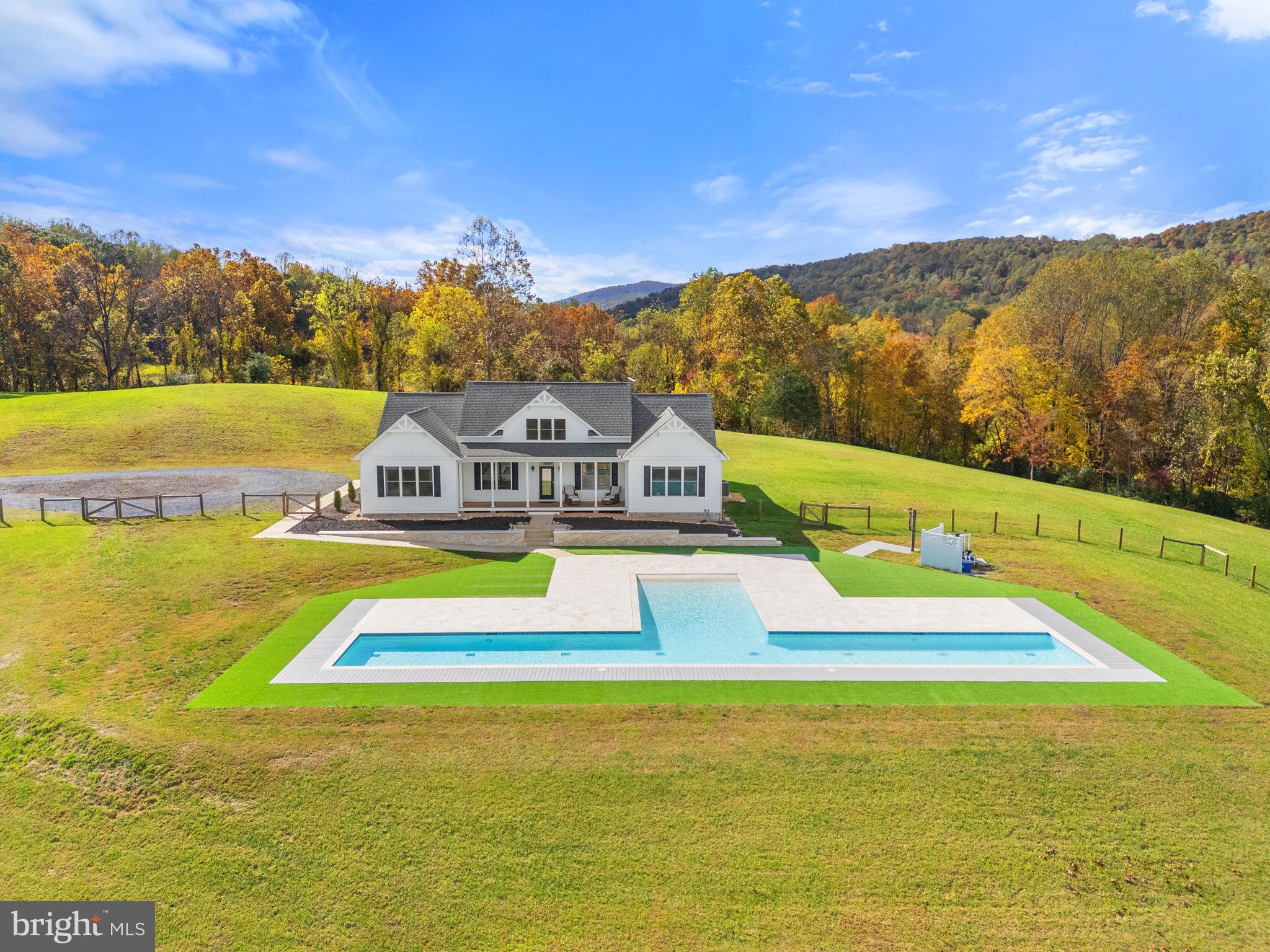 4050 Carrington Road Markham, VA 22643 - Photo 15 of 51 a view of an swimming pool with an ocean view