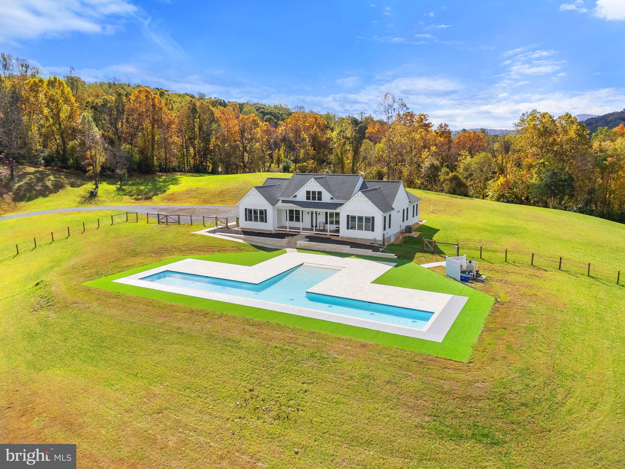 4050 Carrington Road Markham, VA 22643 - Photo 16 of 51 a view of a swimming pool with an ocean view