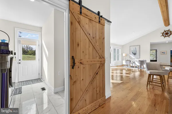 view of living room and kitchen view with wooden floor