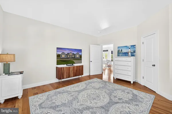 a view of a bedroom with furniture and closet