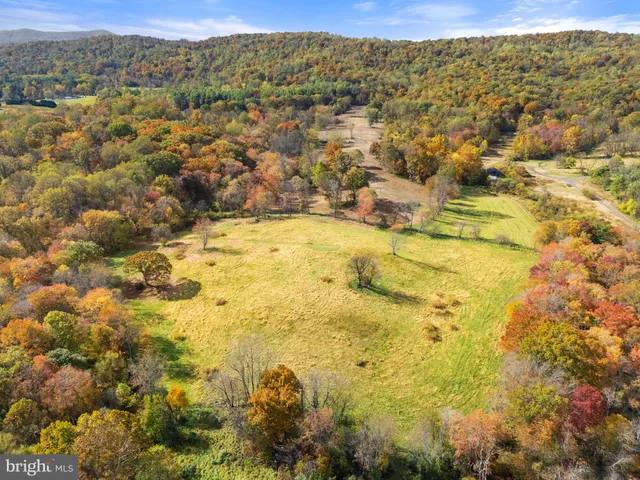 a sign that is on a red and white street sign