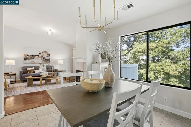 a living room with furniture and large windows