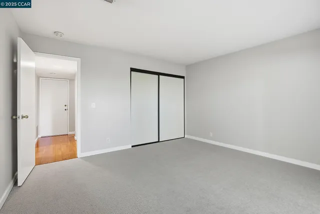 a view of an empty room and window