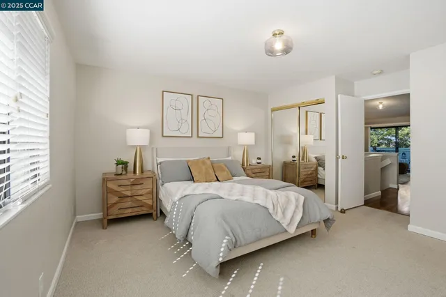 a bedroom with a bed and ceiling fan