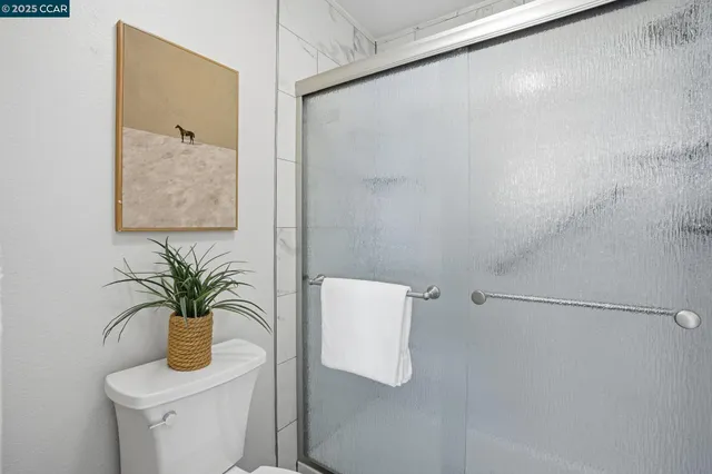 a bathroom with a granite countertop double vanity sinks and a mirror