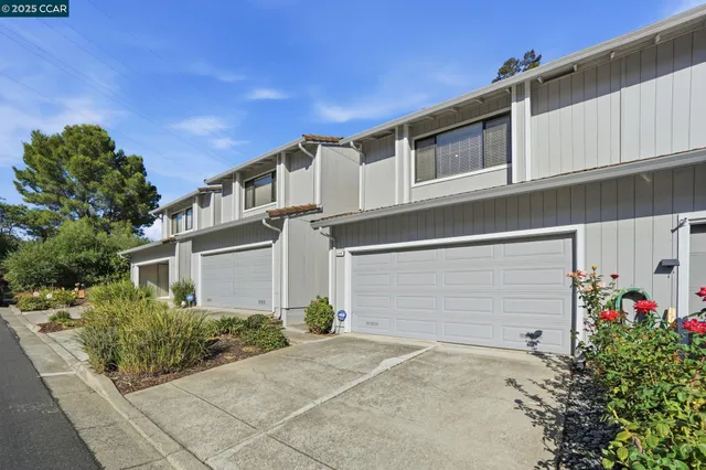 a front view of a house with a garage