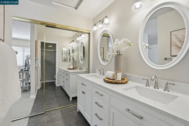 a bathroom with a toilet a sink and a mirror
