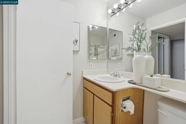 a backyard of a house with wooden floor and outdoor seating