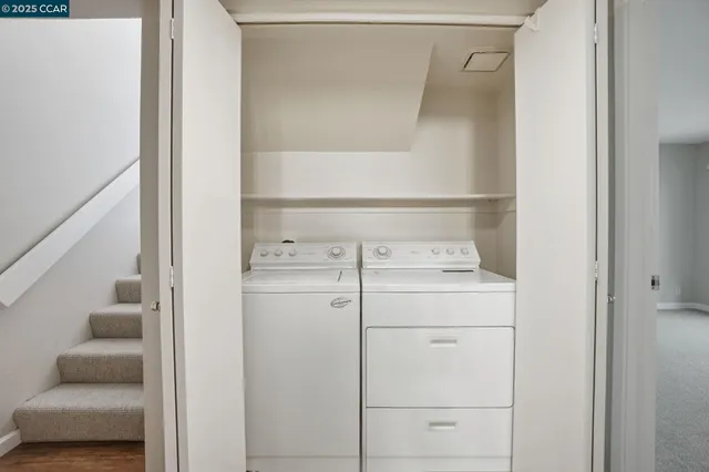 a backyard of a house with a garden and outdoor seating