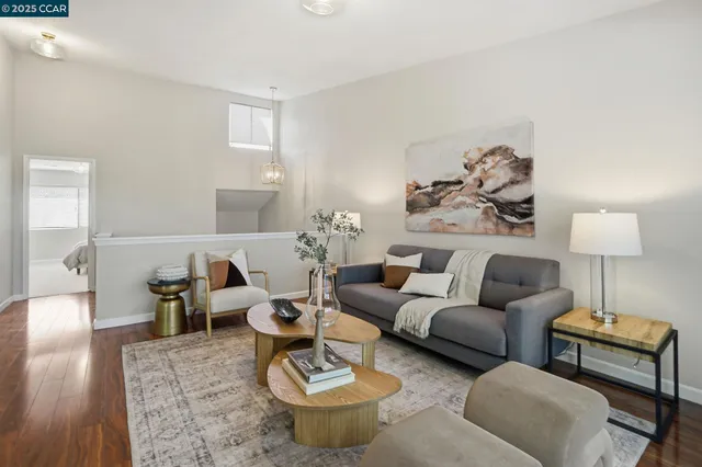 a living room with furniture a lamp and a window