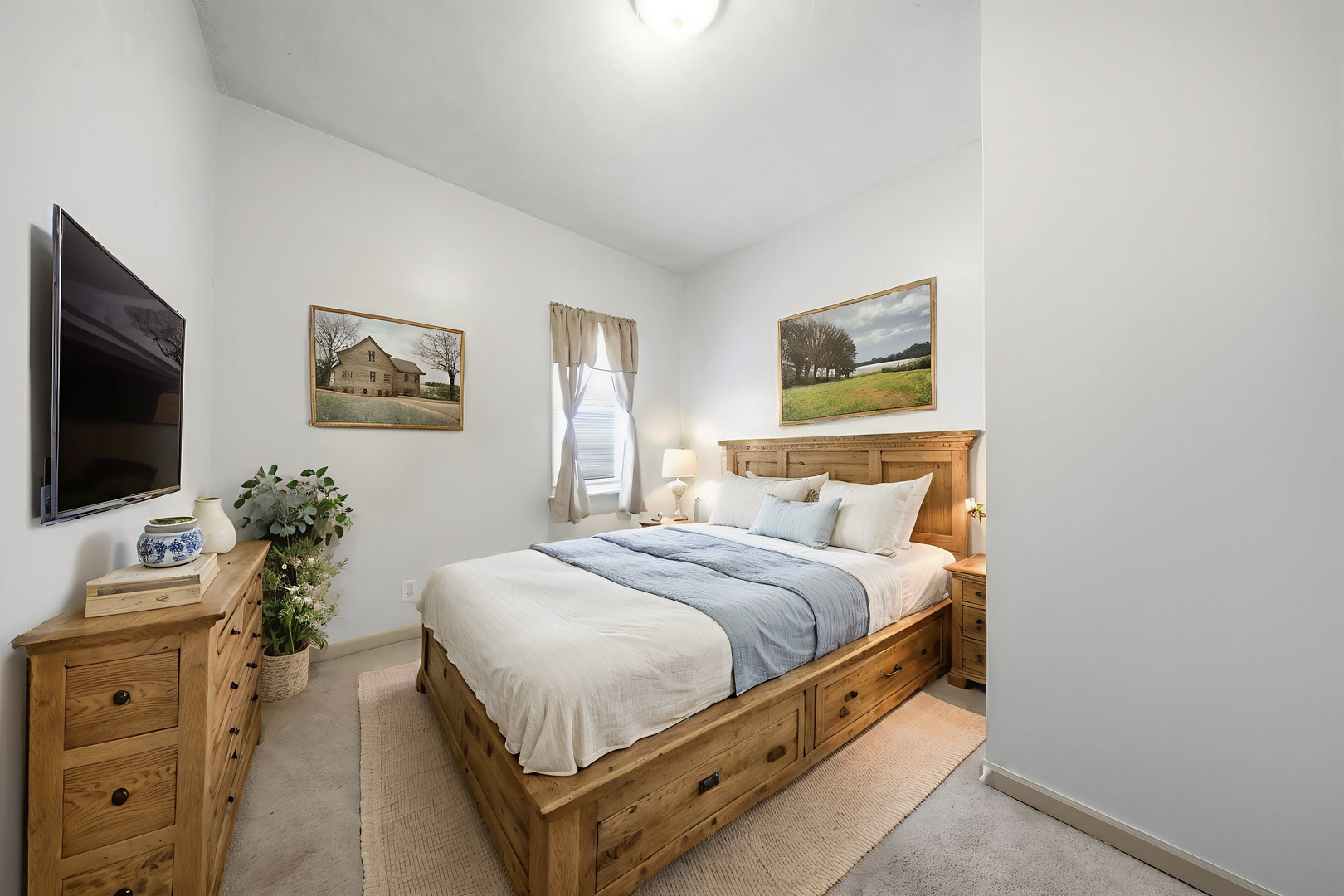 901 Hermann Road Lee, IL 60530 - Photo 19 of 42 a bedroom with a bed and a flat screen tv