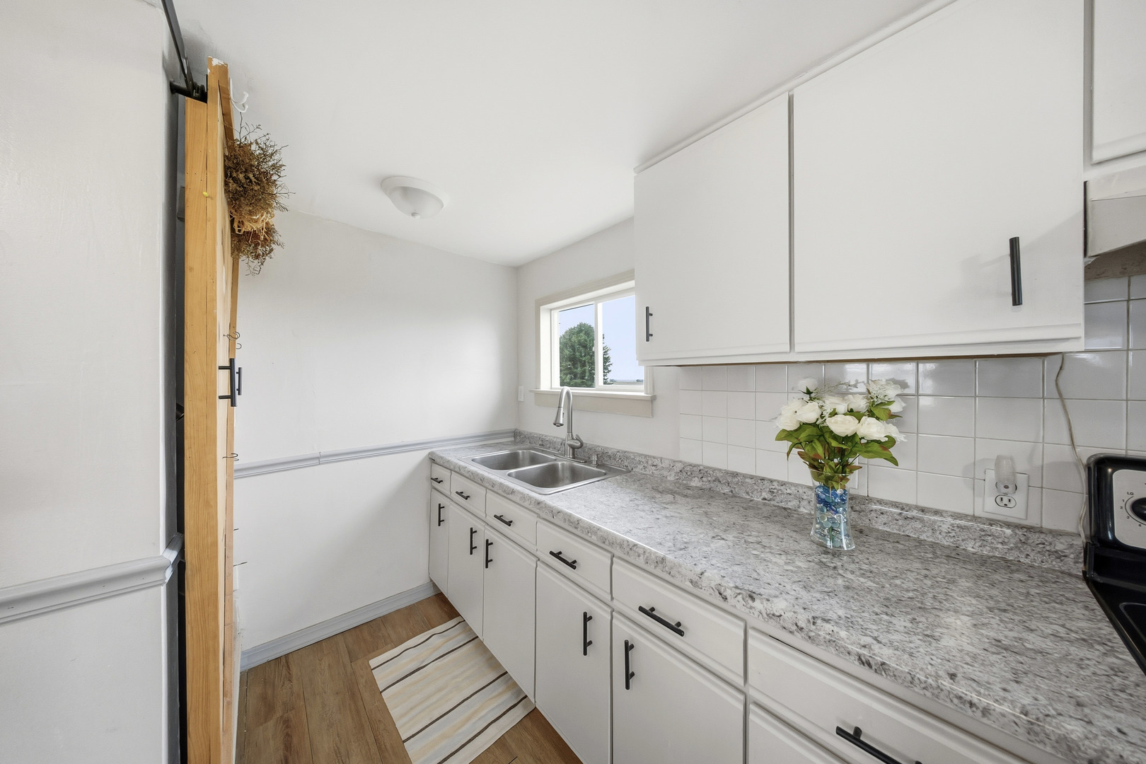 901 Hermann Road Lee, IL 60530 - Photo 24 of 42 a bathroom with a granite countertop sink a mirror and vanity