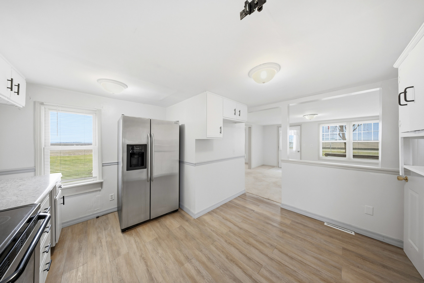 901 Hermann Road Lee, IL 60530 - Photo 25 of 42 a view of a kitchen with wooden floor and electronic appliances