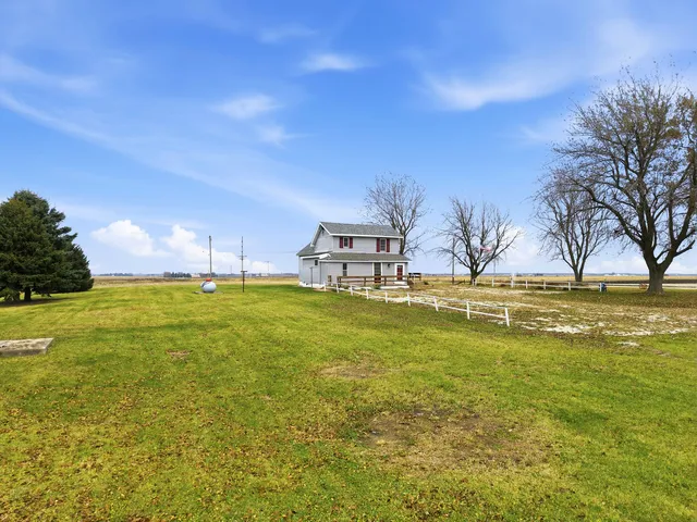 a picture of a bench in front of a wall