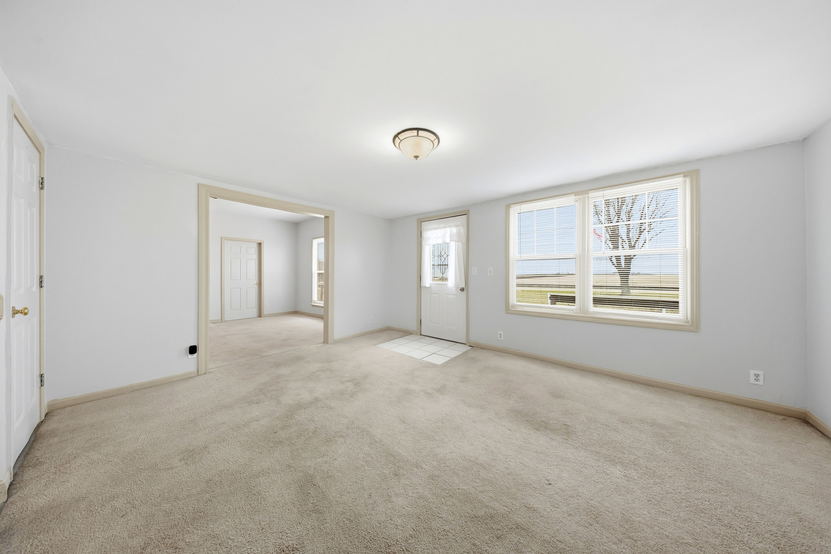 901 Hermann Road Lee, IL 60530 - Photo 4 of 42 a view of an empty room with a window