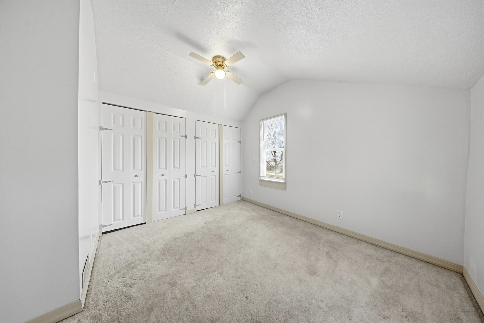 901 Hermann Road Lee, IL 60530 - Photo 9 of 42 an empty room with windows and fan chandelier fan