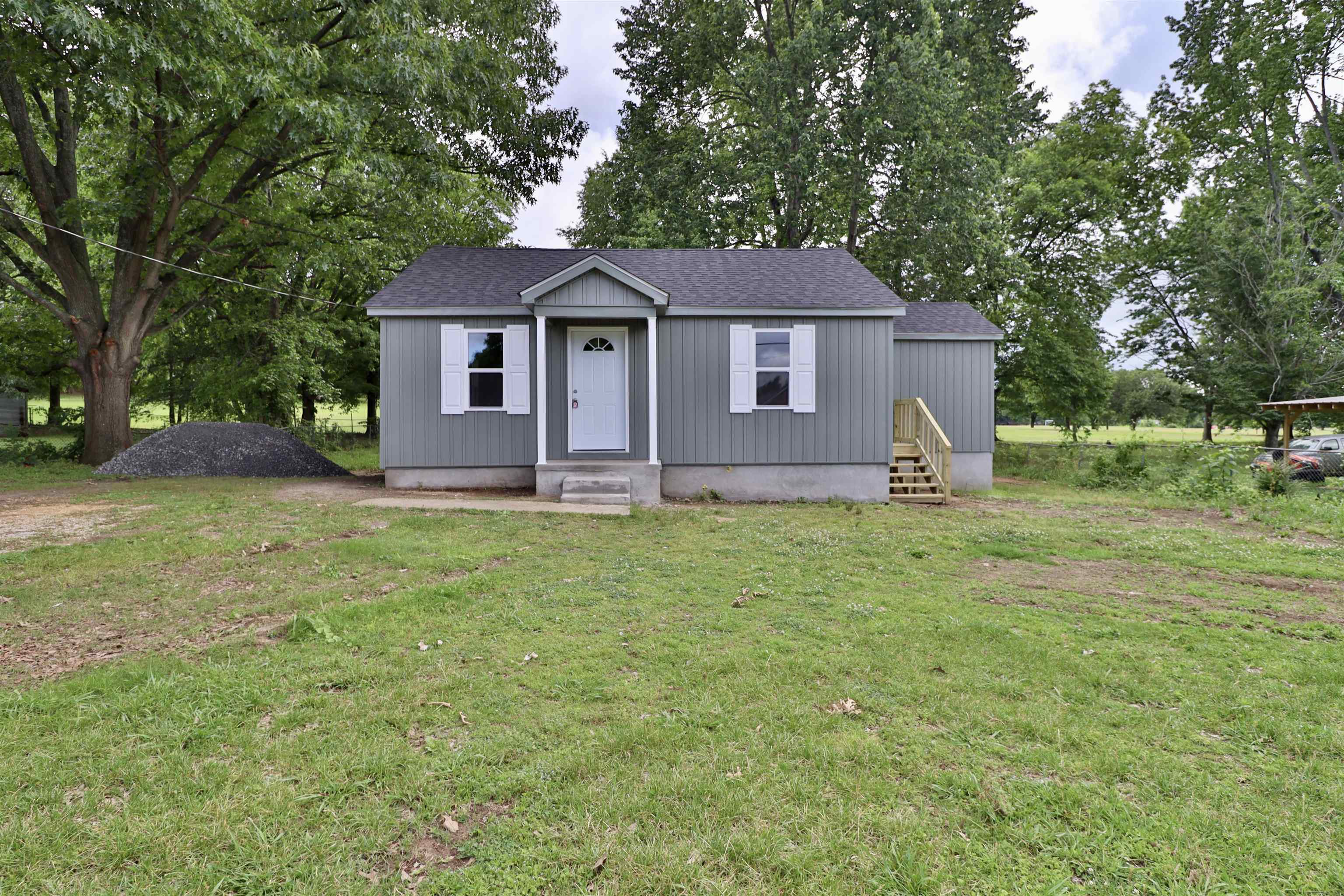 224 Kellar Avenue Ripley, TN 38063 - Photo 26 of 30 a front view of a house with garden