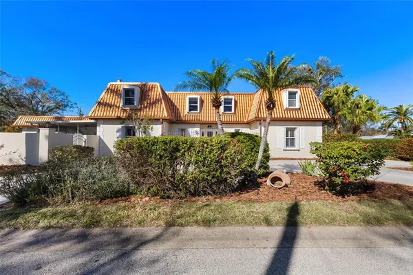 a living room with furniture flat screen tv and wooden floor