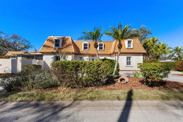 a living room with furniture flat screen tv and wooden floor