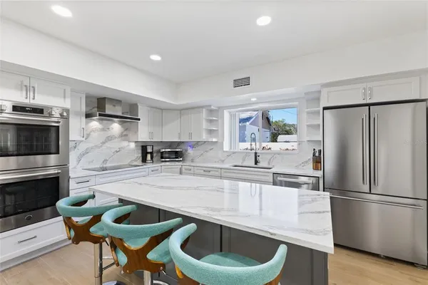 a living room with fireplace furniture and a flat screen tv
