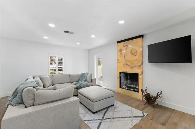 a living room with furniture and a window