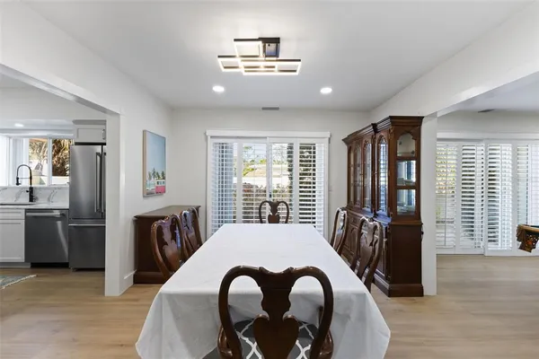 a bathroom with a granite countertop sink mirror and