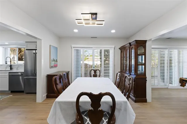 a bathroom with a granite countertop sink mirror and