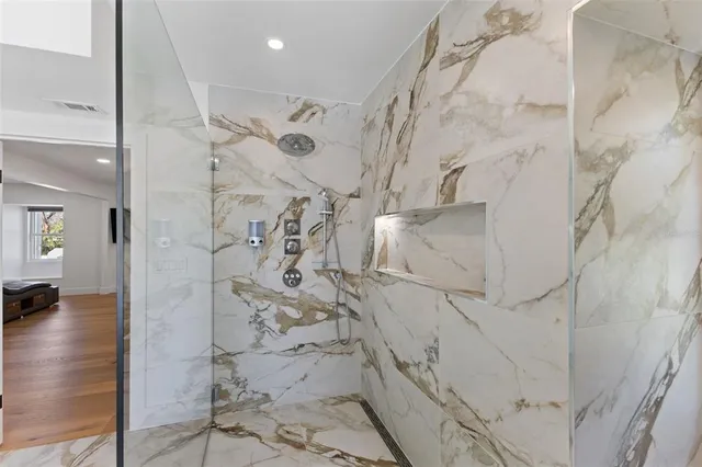 a view of a storage & utility room with two washing machine