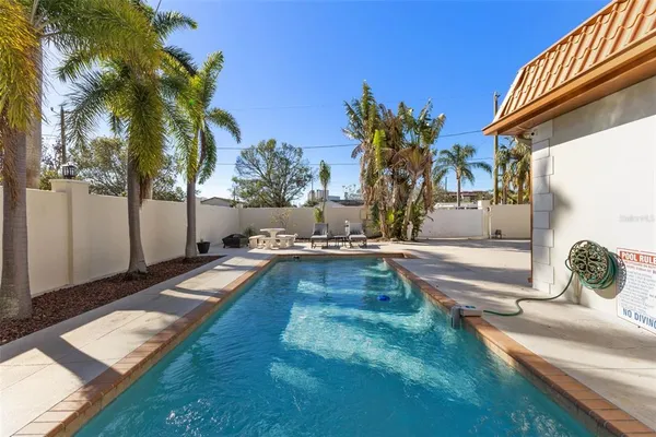 a view of a swimming pool with a patio