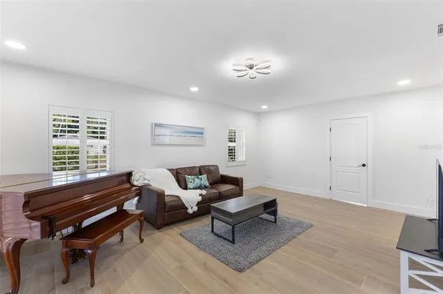a kitchen with sink refrigerator and window