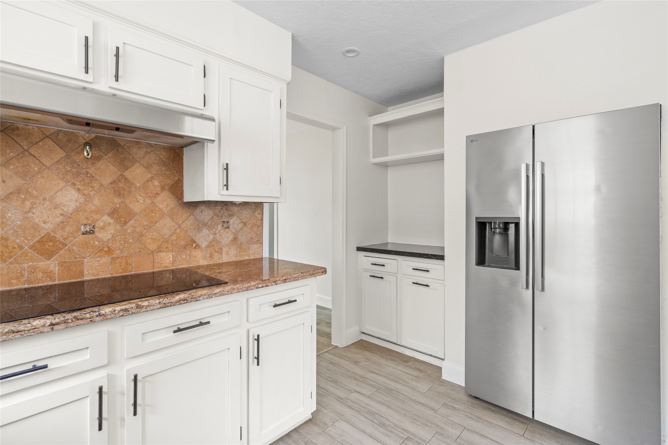 560 Landfall Lane Conroe, TX 77302 - Photo 24 of 41 The stainless-steel side-by-side refrigerator stays.