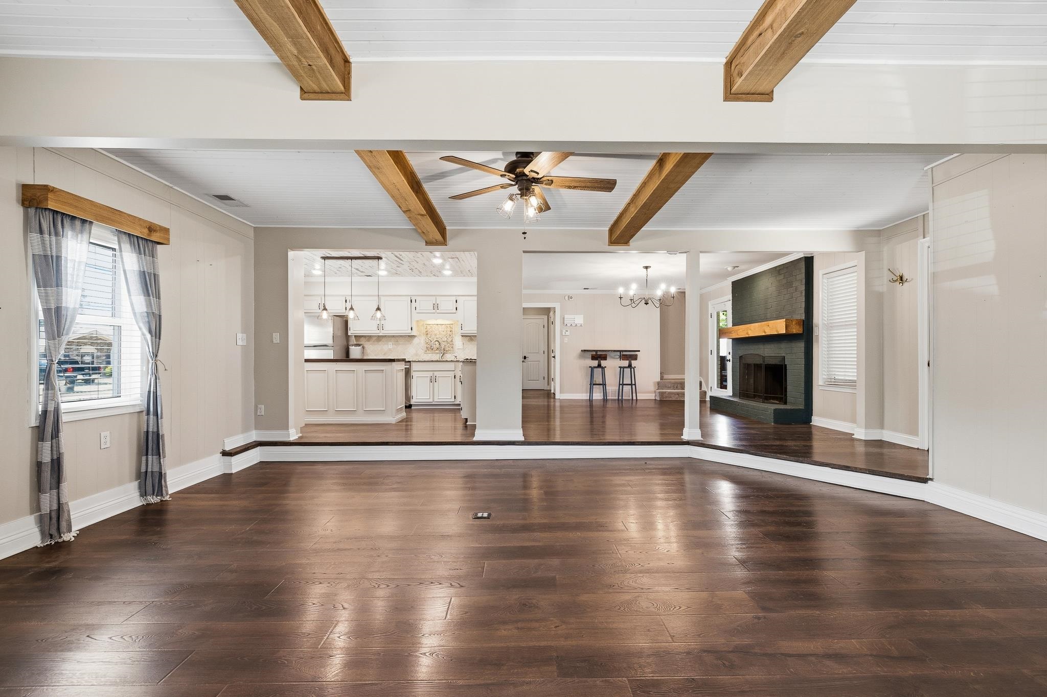 1234 Greenview Road Collierville, TN 38017 - Photo 7 of 33 a view of an empty room with wooden floor and a window