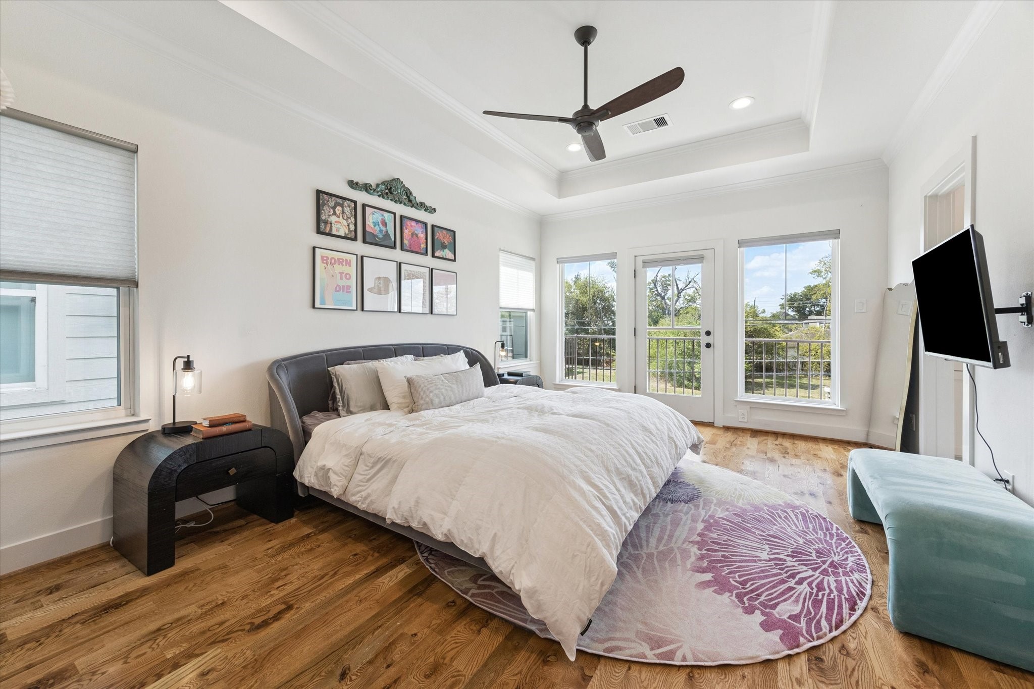 3404 Castor Street Houston, TX 77022 - Photo 15 of 30 a bed room with a bed a flat screen tv and a large window