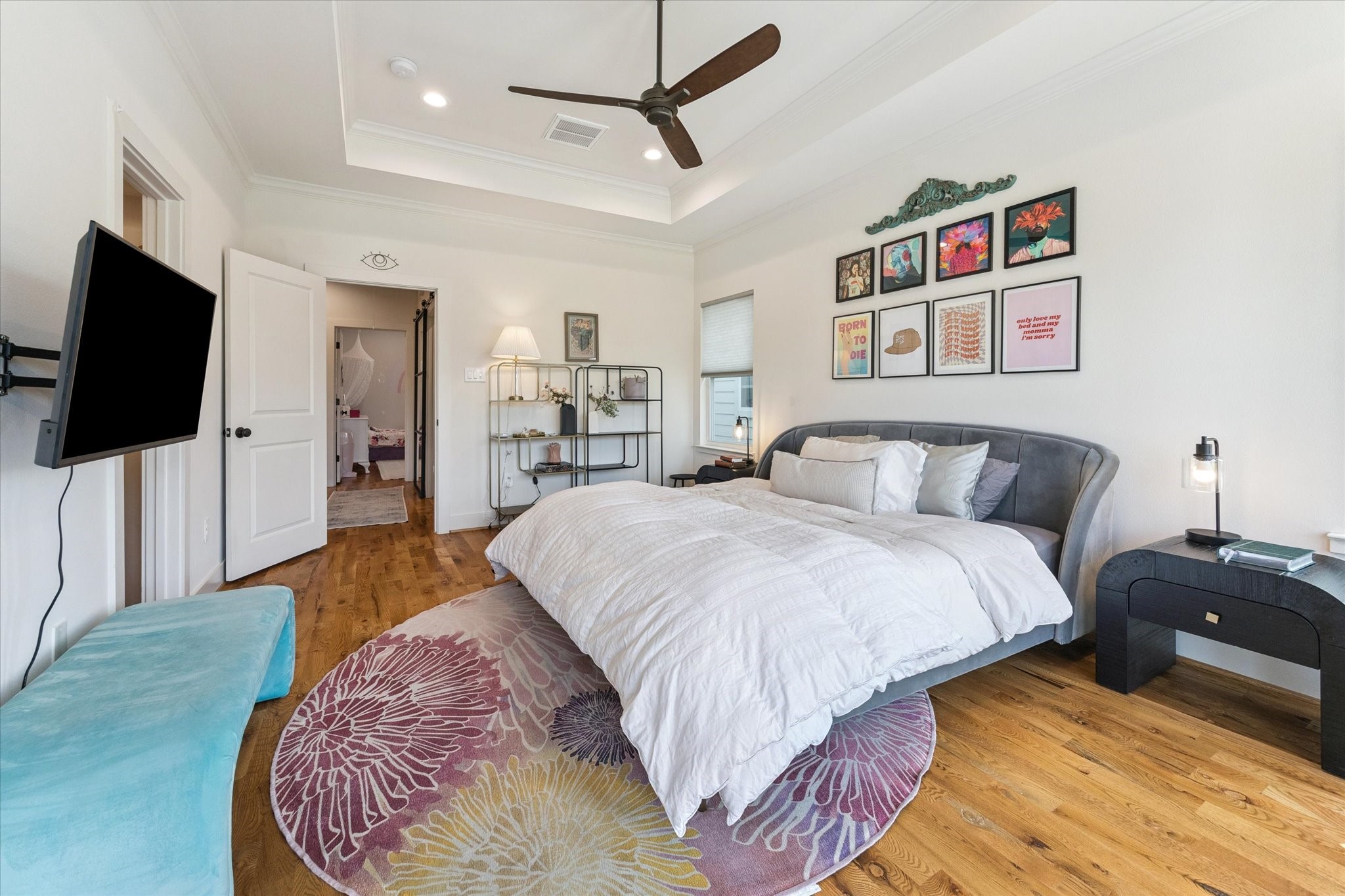 3404 Castor Street Houston, TX 77022 - Photo 16 of 30 a spacious bedroom with a bed and a flat screen tv