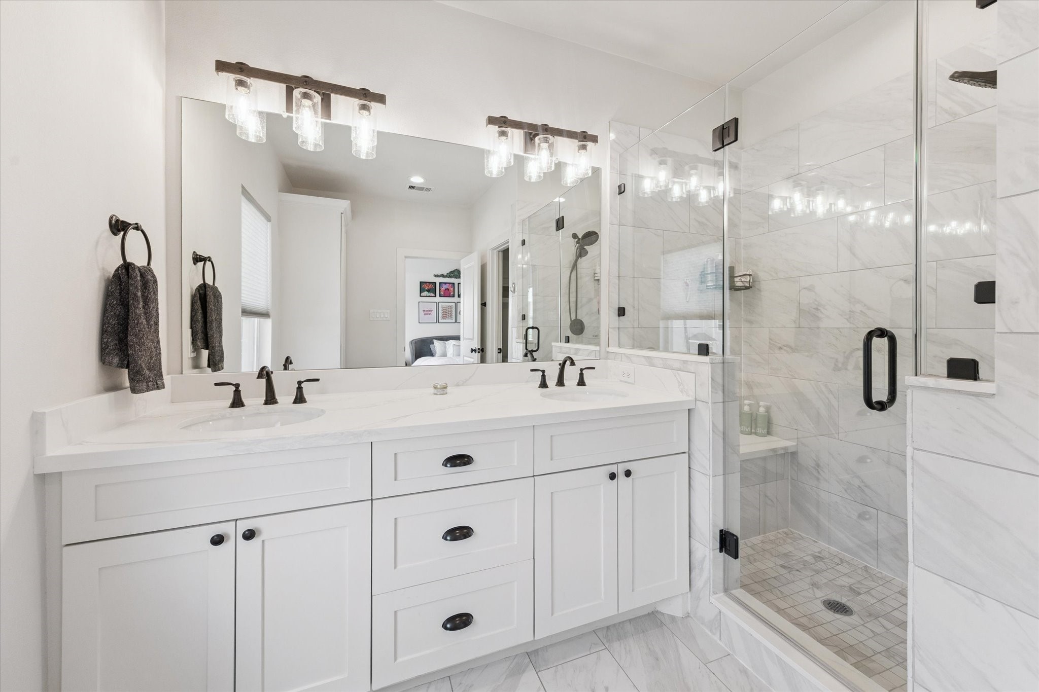 3404 Castor Street Houston, TX 77022 - Photo 18 of 30 a bathroom with a shower sink and mirror
