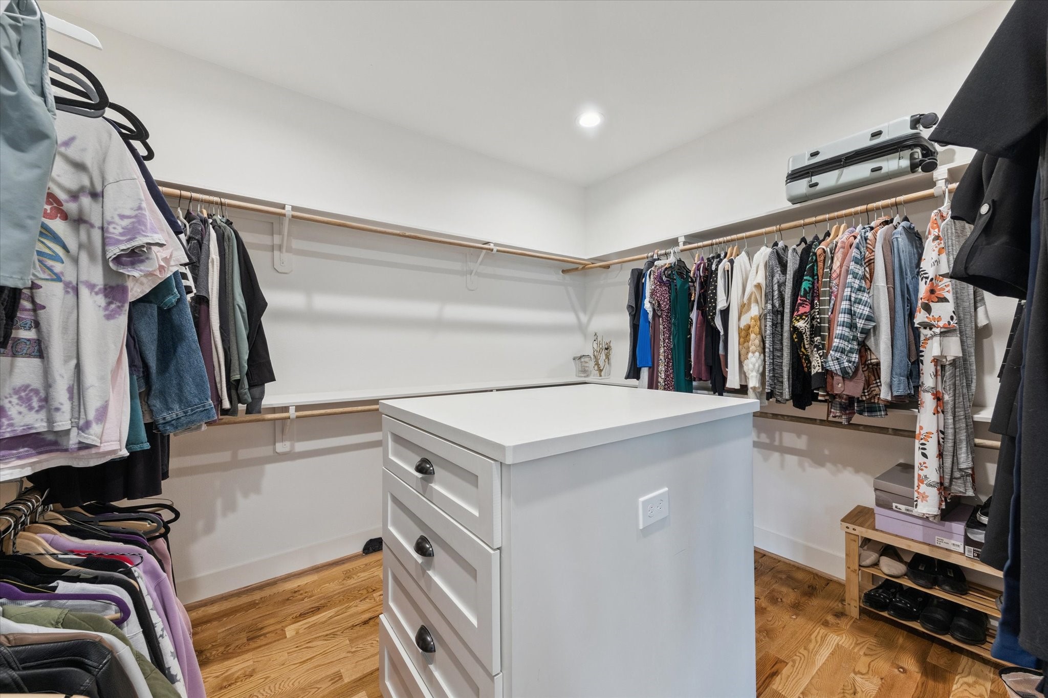 3404 Castor Street Houston, TX 77022 - Photo 19 of 30 a view of walk in closet with clothes and shoes
