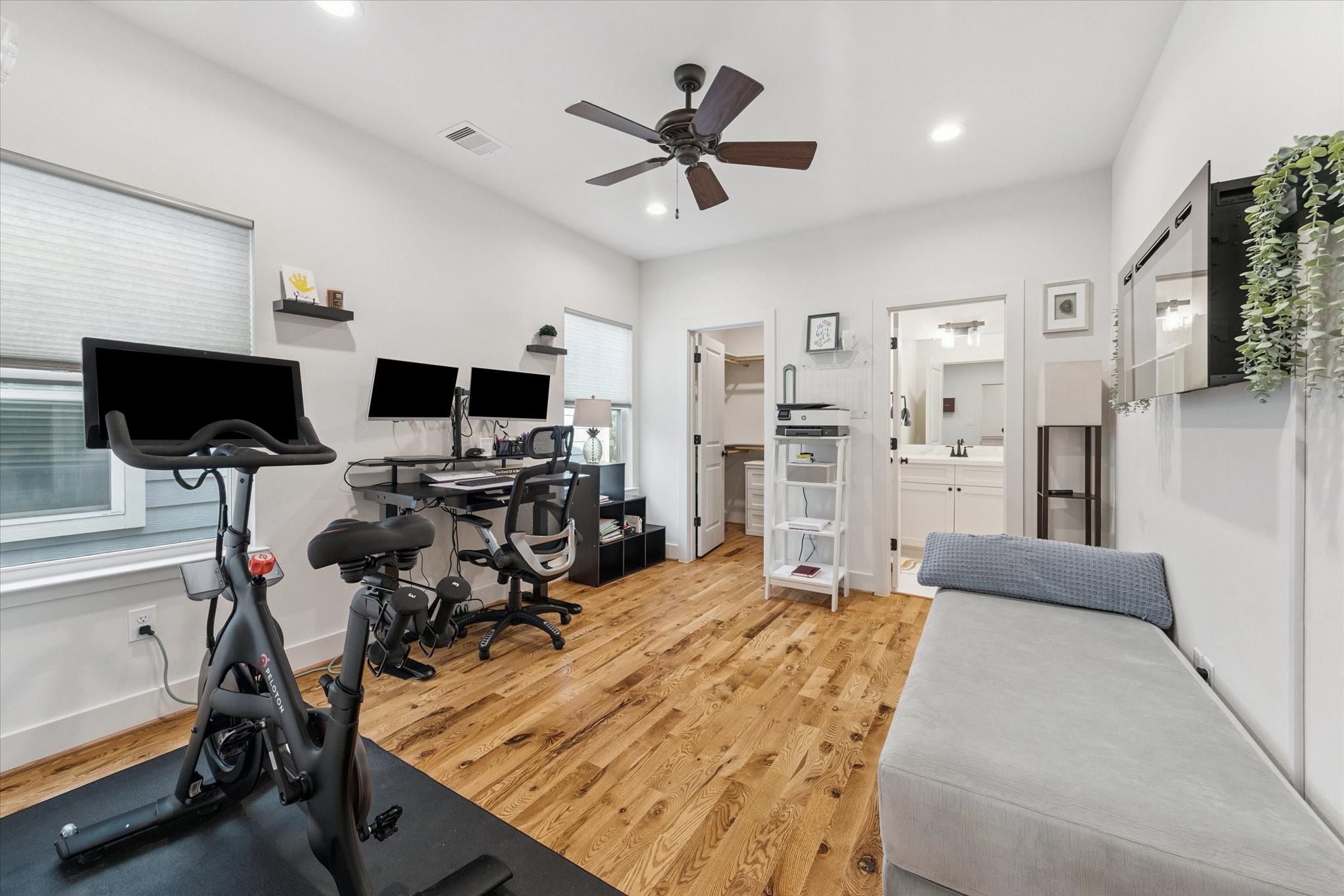 3404 Castor Street Houston, TX 77022 - Photo 22 of 30 a room with a bed and a flat screen tv