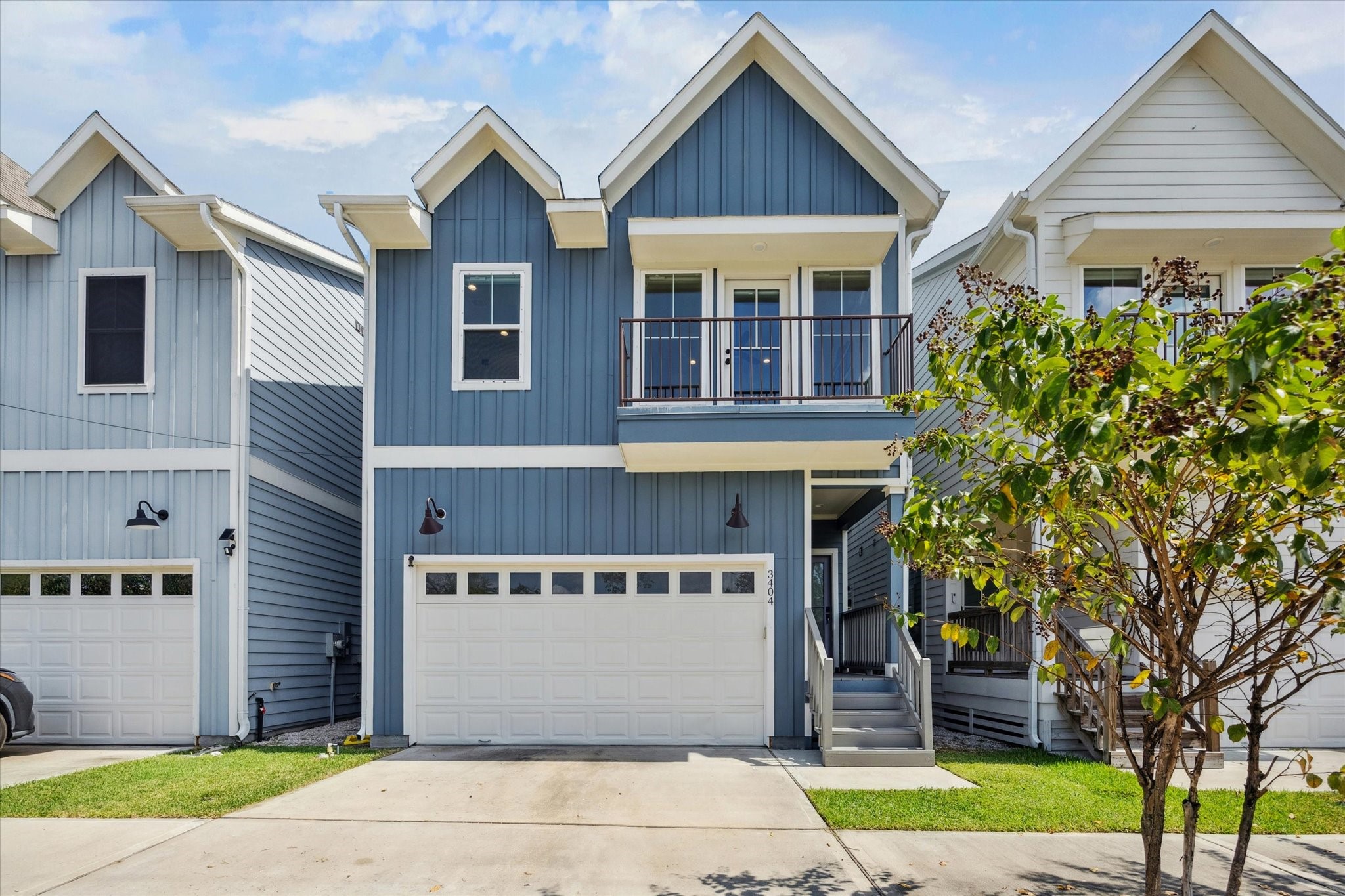 3404 Castor Street Houston, TX 77022 - Photo 3 of 30 a front view of a house with a yard and garage