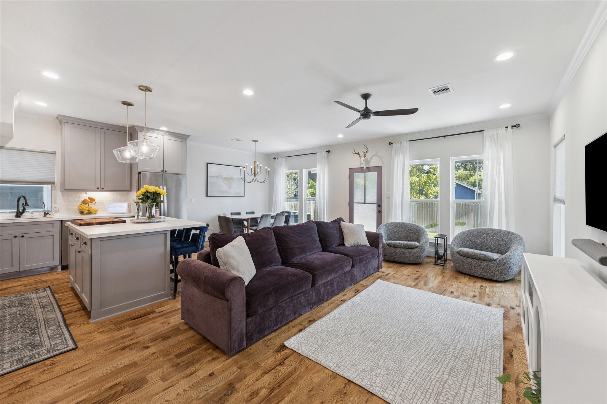 3404 Castor Street Houston, TX 77022 - Photo 6 of 30 a living room with furniture a ceiling fan and a window