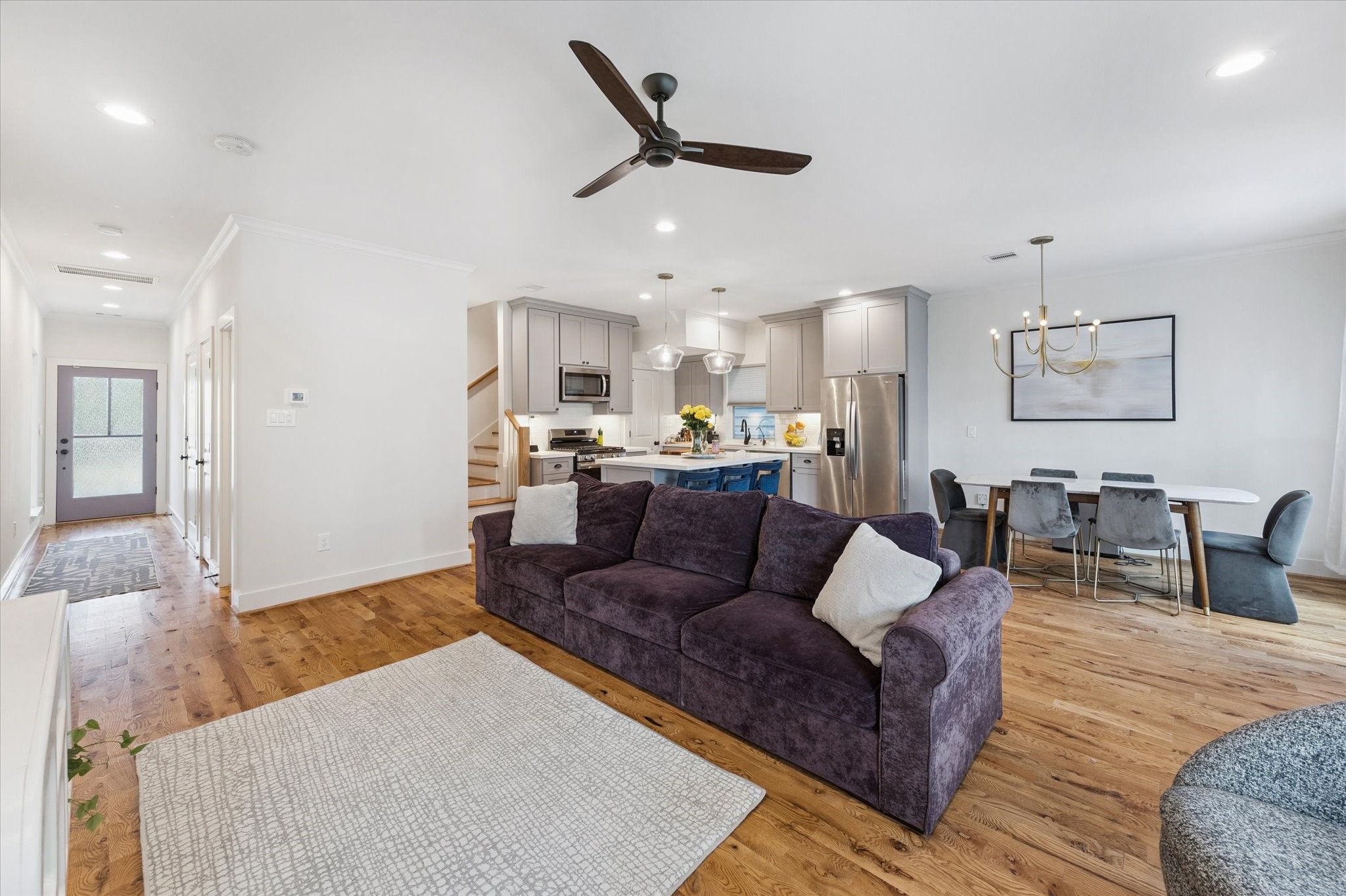 3404 Castor Street Houston, TX 77022 - Photo 7 of 30 a living room with furniture kitchen area and a ceiling fan