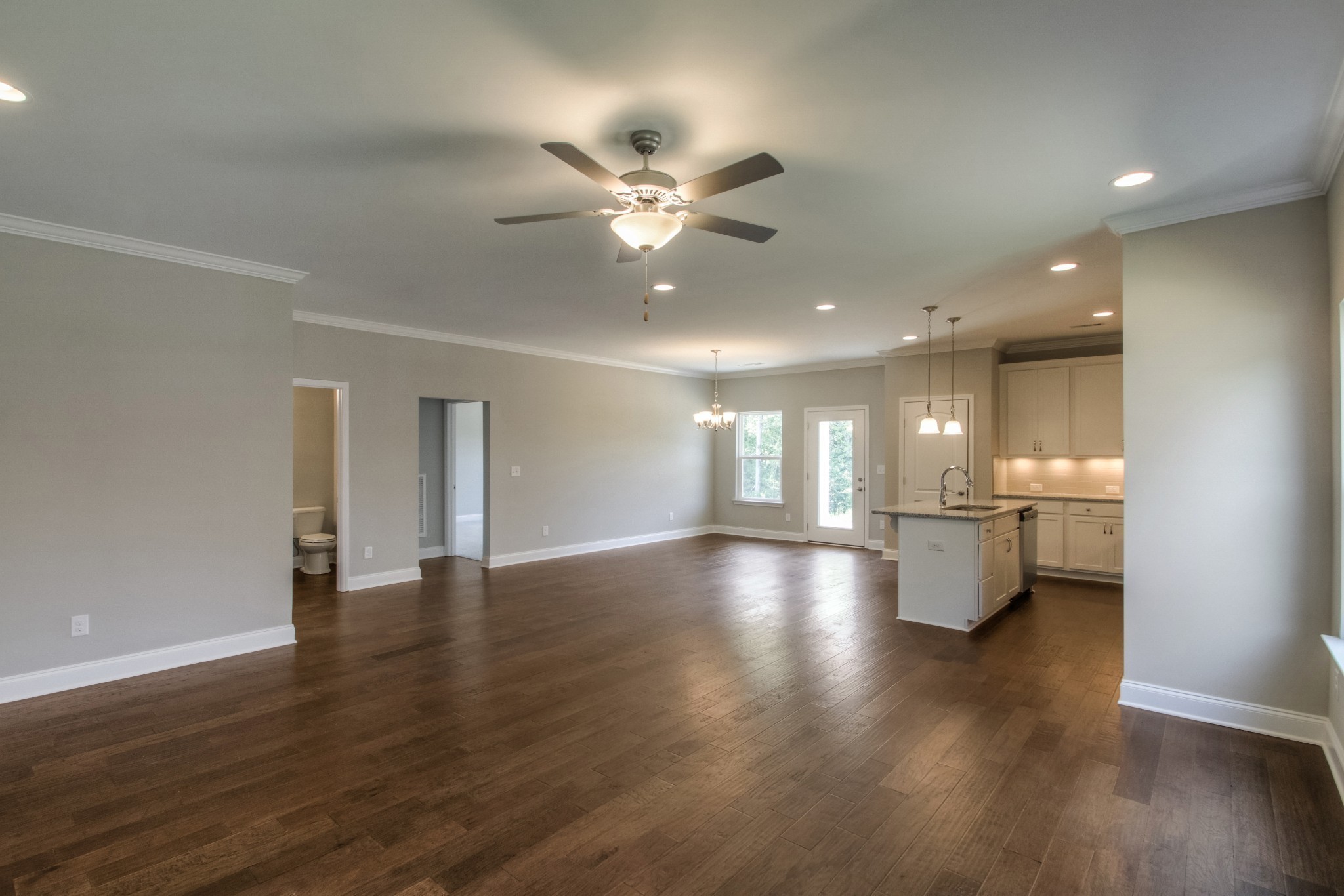 1529 Holton Road Gallatin, TN 37066 - Photo 12 of 33 a view of an empty room with window and wooden floor
