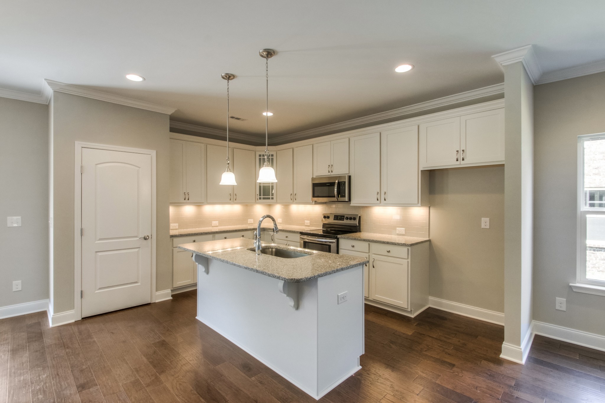 1529 Holton Road Gallatin, TN 37066 - Photo 6 of 33 a kitchen with a refrigerator a sink and wooden floor